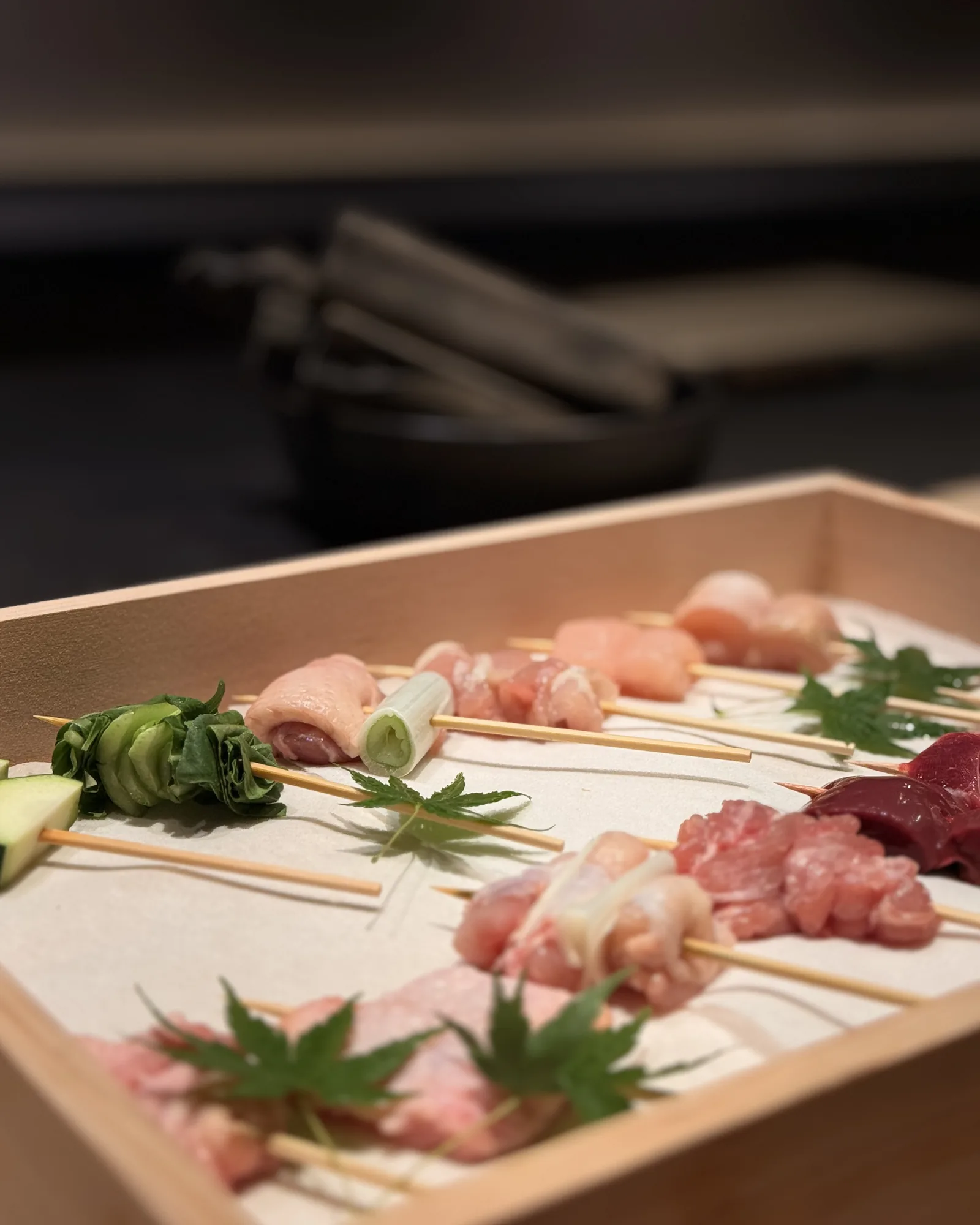 Raw heritage chicken skewers arranged on a tray