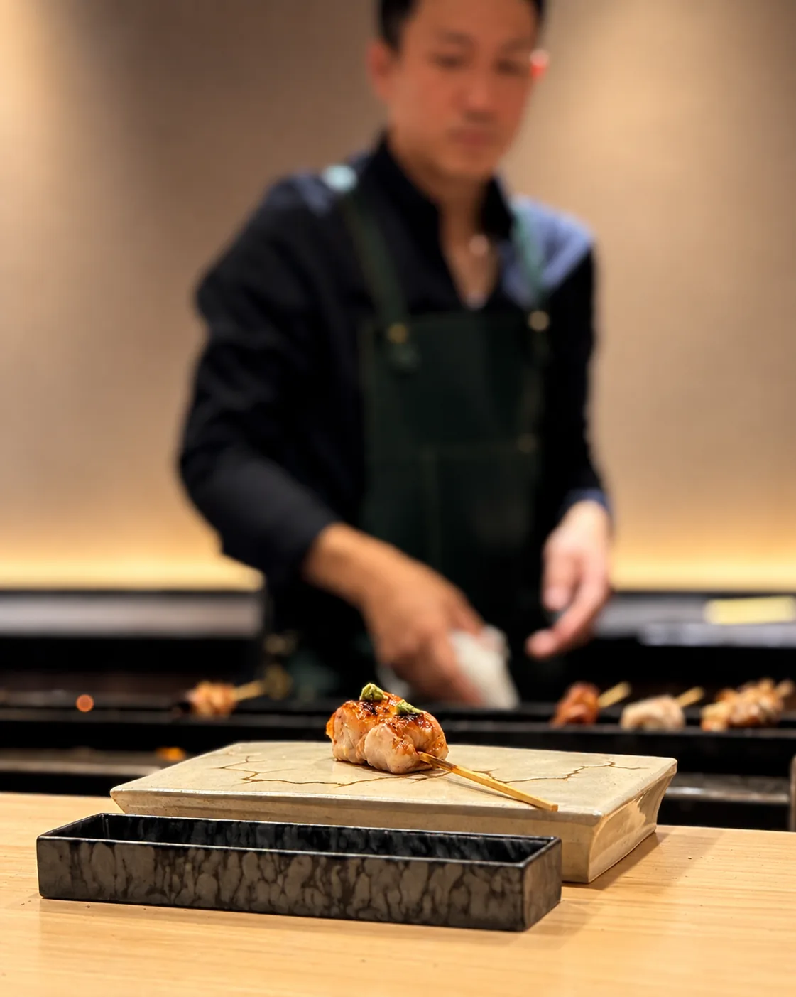 Plated yakitori skewer at the counter