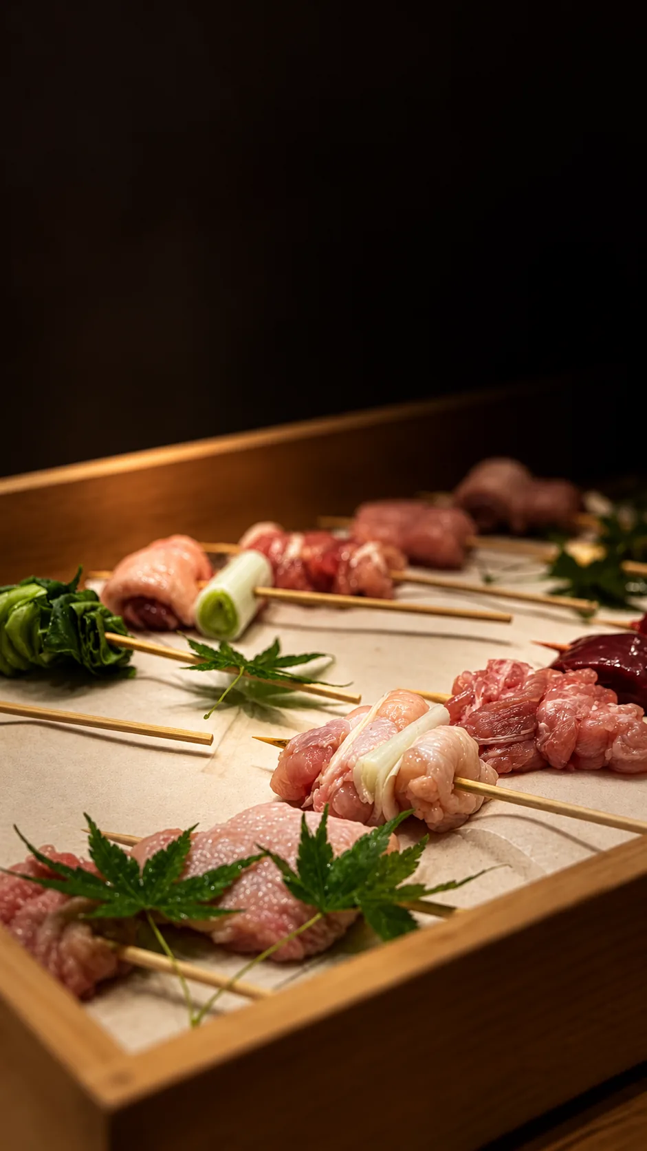 Yakitori skewers arranged on a wooden tray